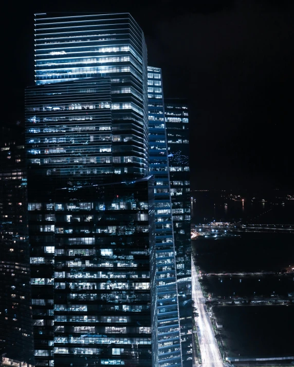 view of skyscr in night from roof top