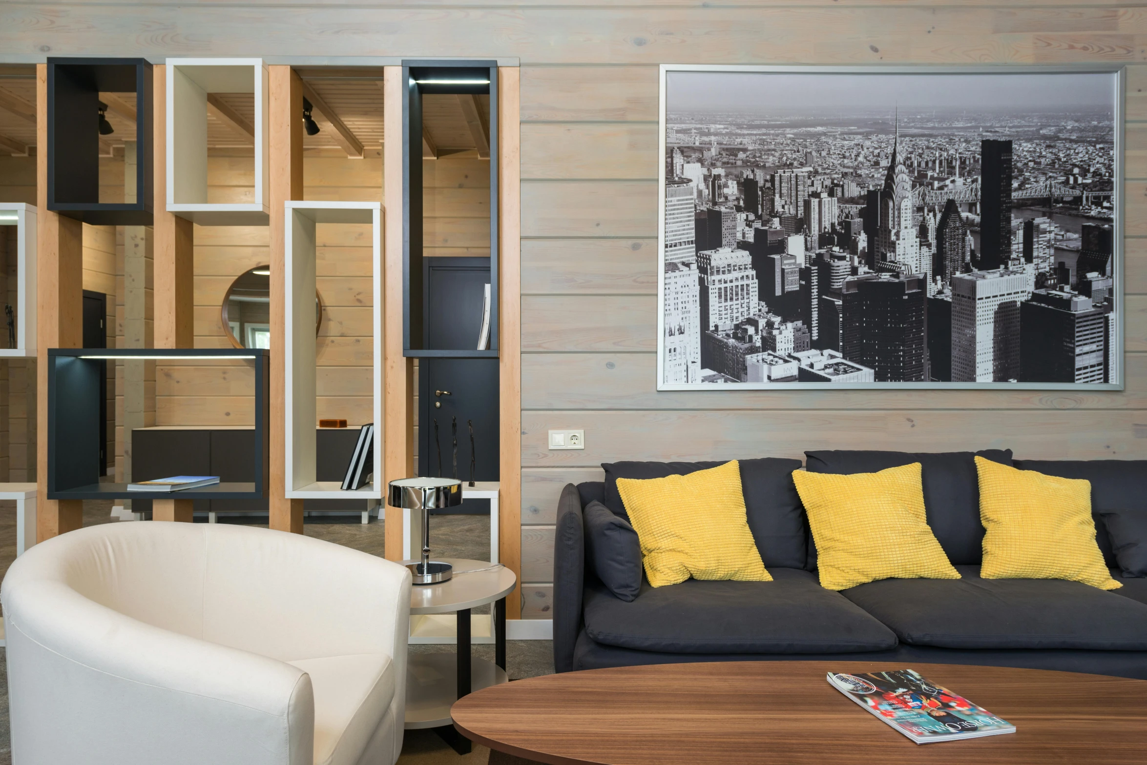 the interior of a modern home with yellow and gray cushions