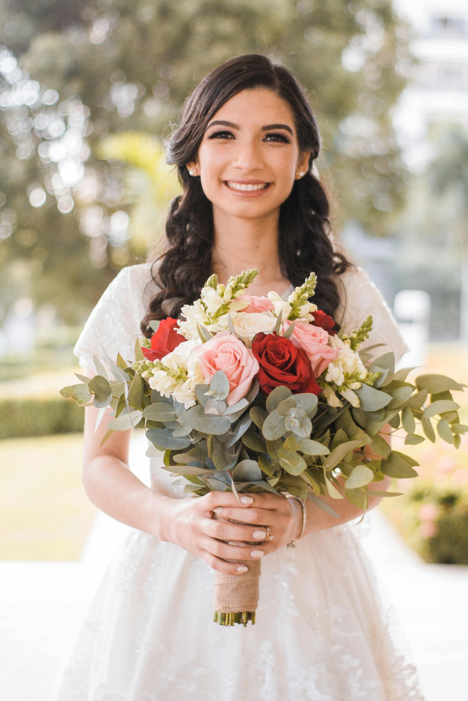 a woman holding a bouquet of flowers