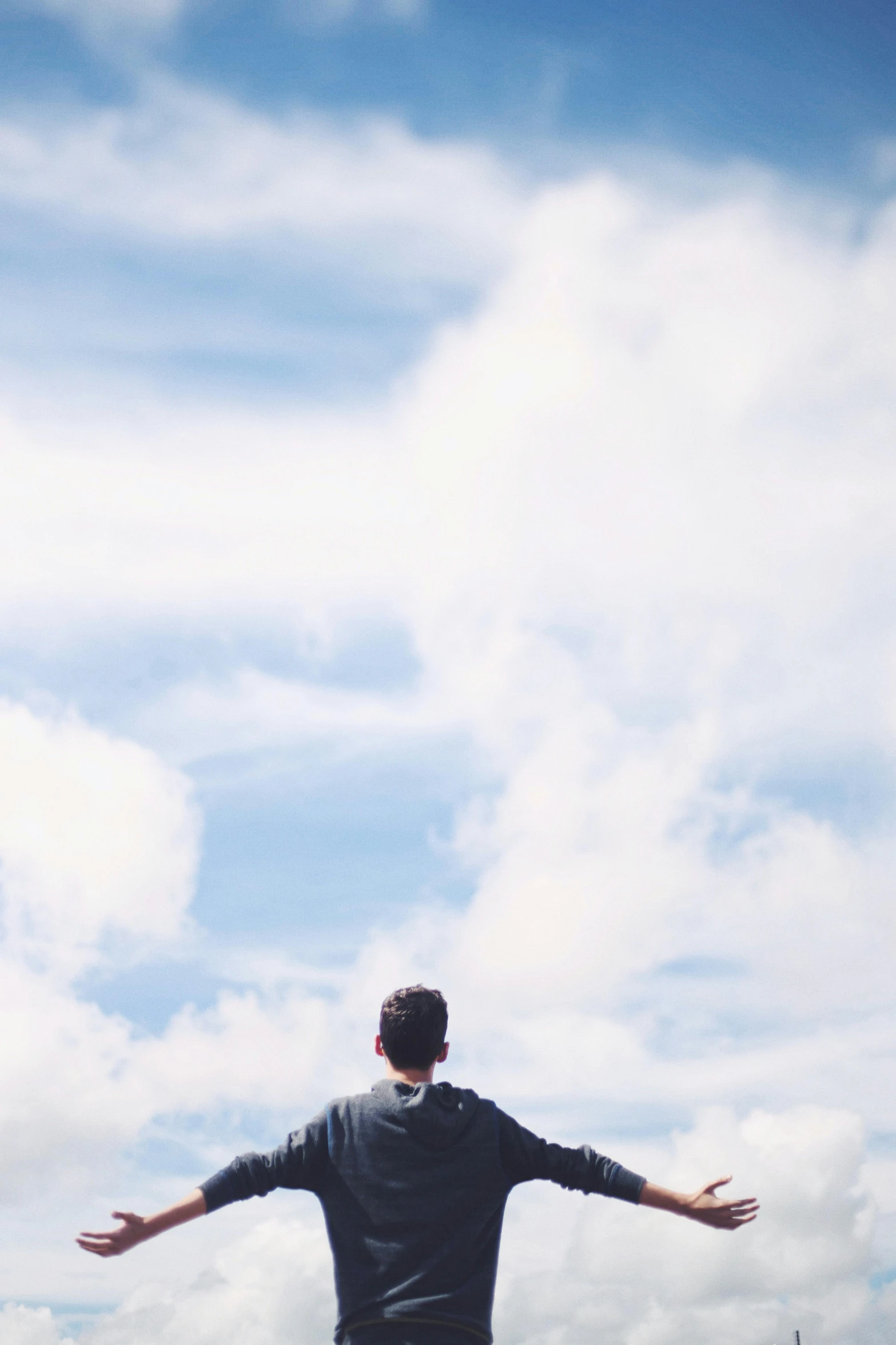 a young man riding on the back of a skateboard