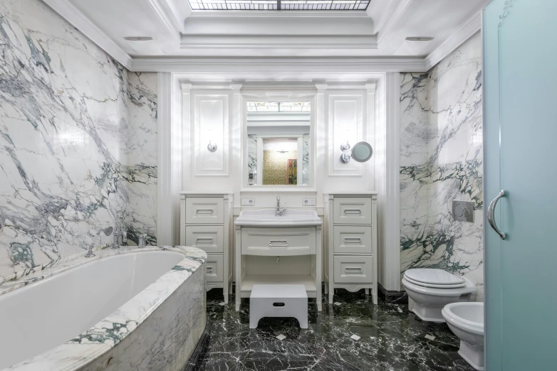 a fancy bathroom with a white marbled wall