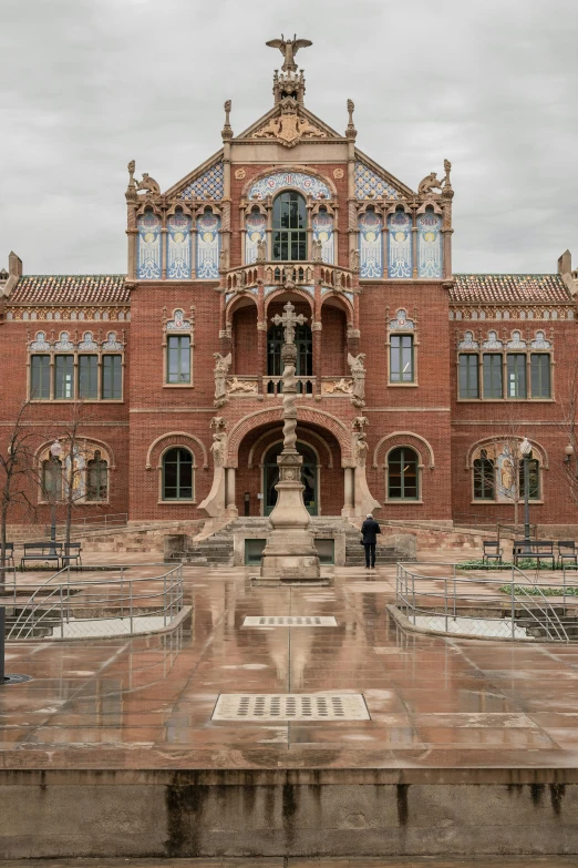 a large brick building with statues and other things