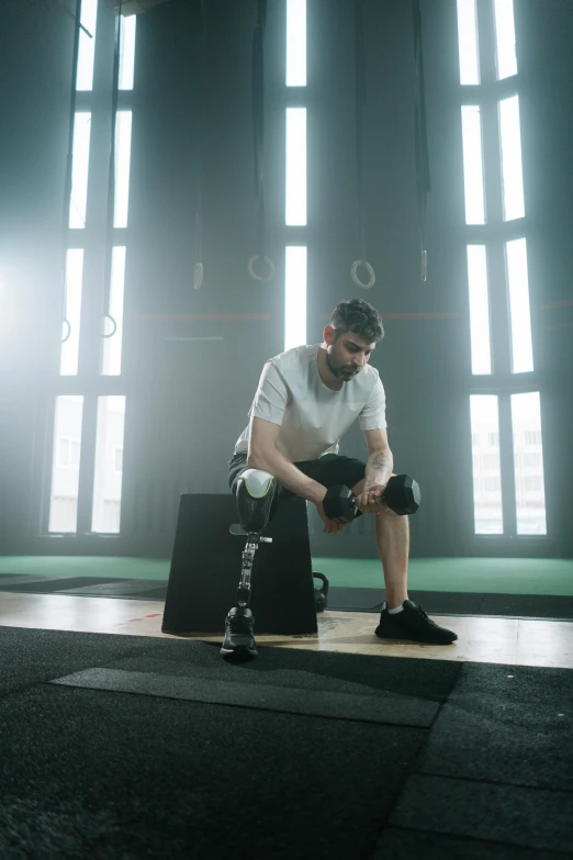 a man kneeling in front of a suitcase with knee ces