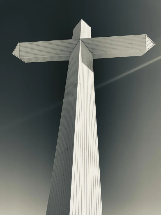 an upward view of the cross against the sky