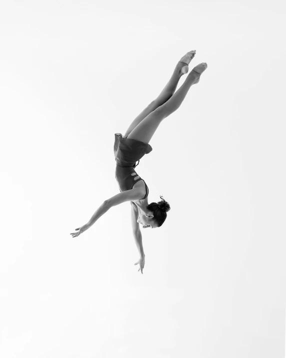 a woman is diving into the water from her board