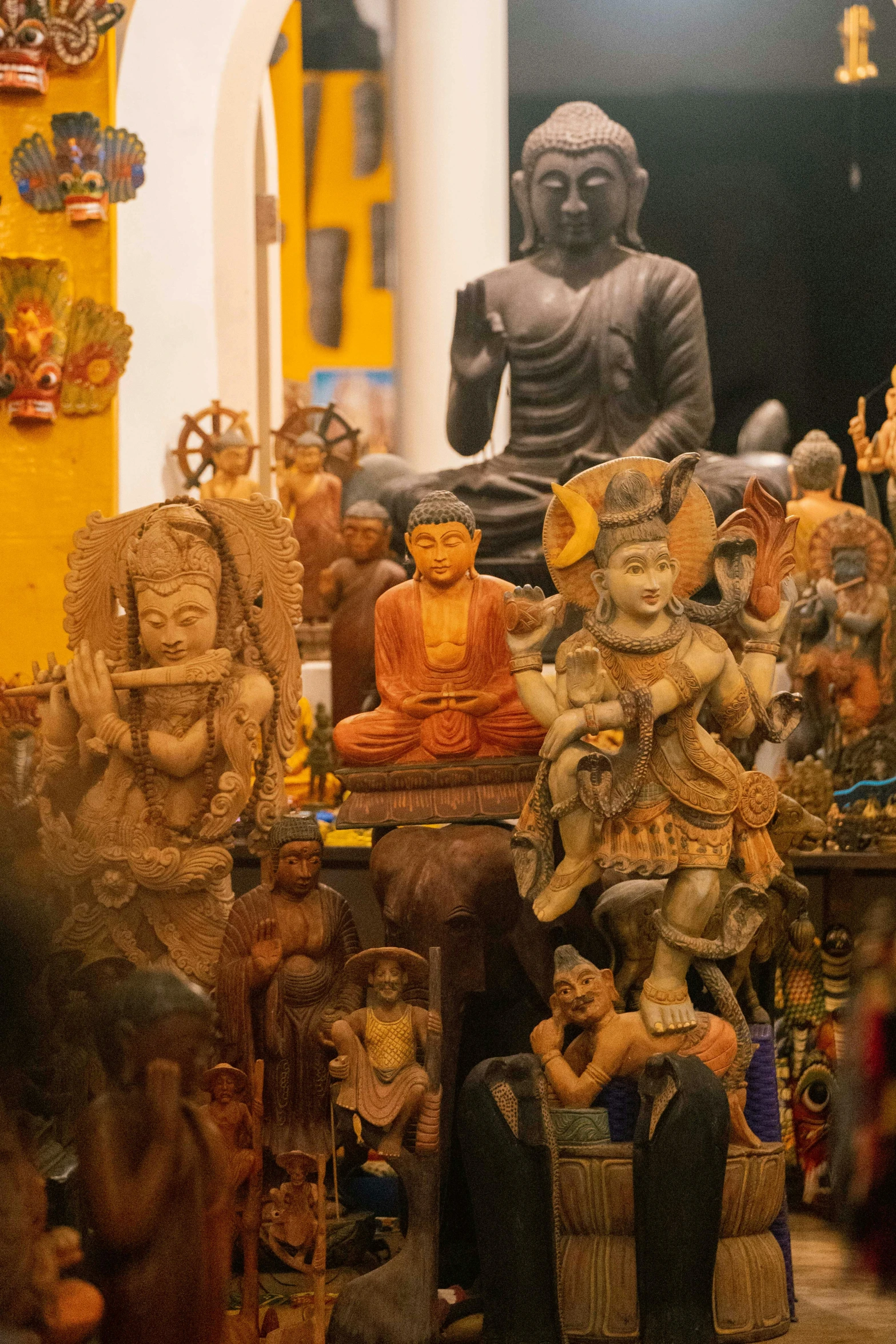 a group of clay statues that are standing up