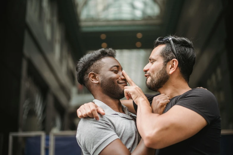 two men emcing each other with the image in front of them