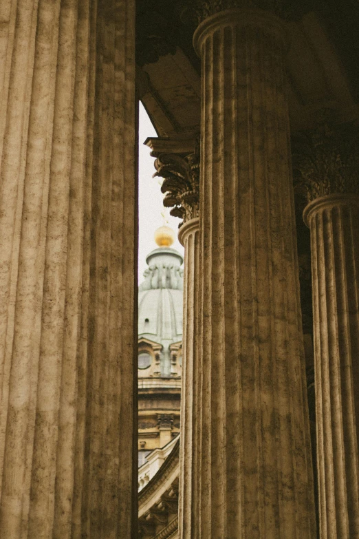 there is an old stone building with many columns