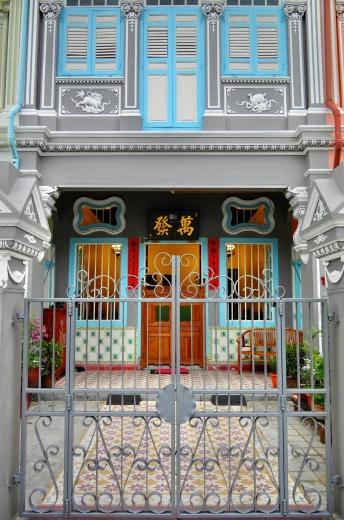 this is an outside view of a house with a fancy gate