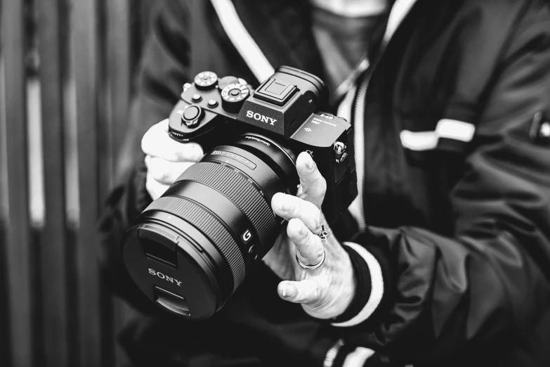 a man holding a camera up to his face