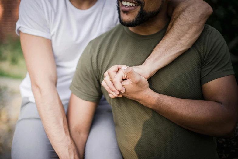 an image of a man holding another mans hand