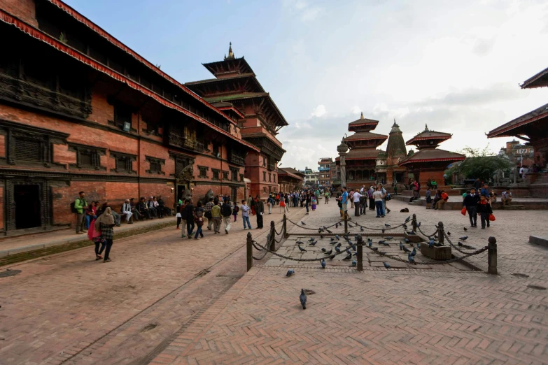 a group of people standing in front of buildings