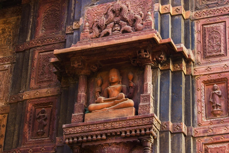 an ornate wall with sculptures on it