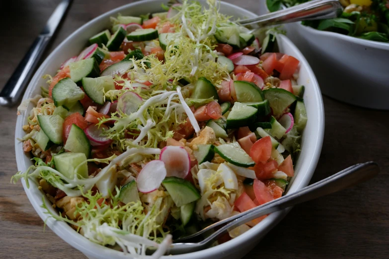 this salad is topped with a variety of vegetables