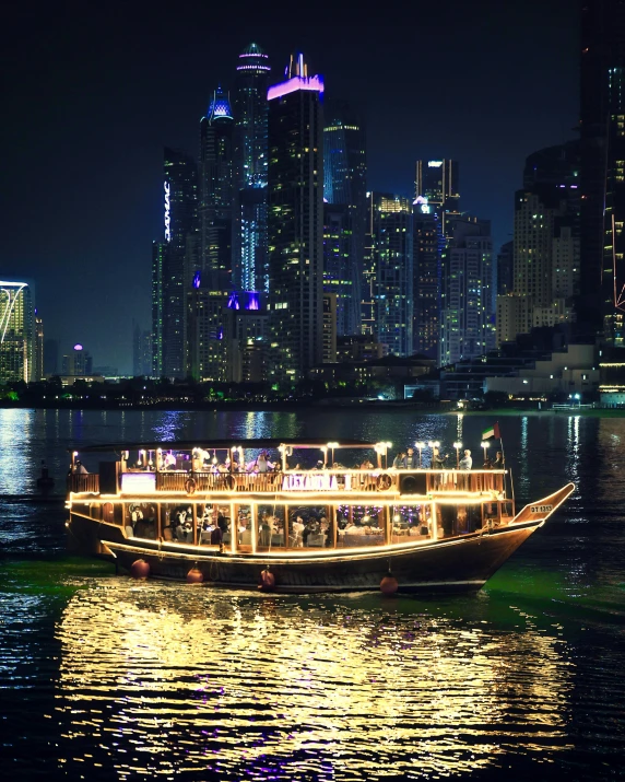 a large boat floating on a body of water near a city