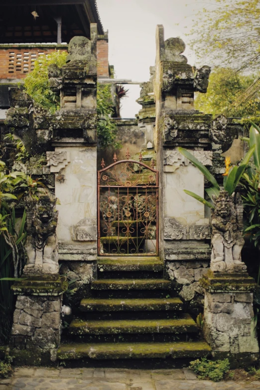 the gate to an ancient building sits outside