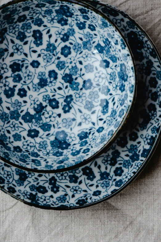 blue and white floral dishware with matching bands