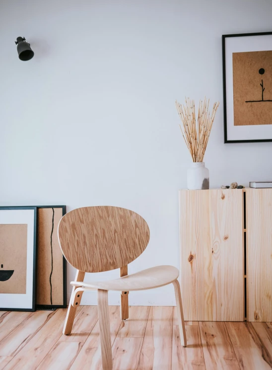 a small wooden chair on a wooden floor