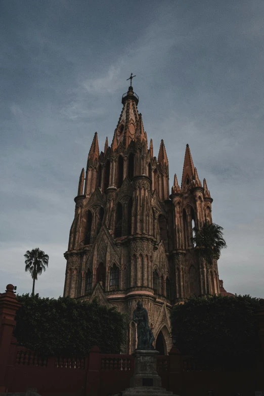 an old church against a cloudy blue sky