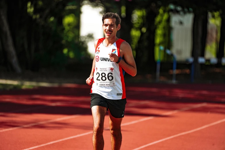 a man in black and white is running on a court