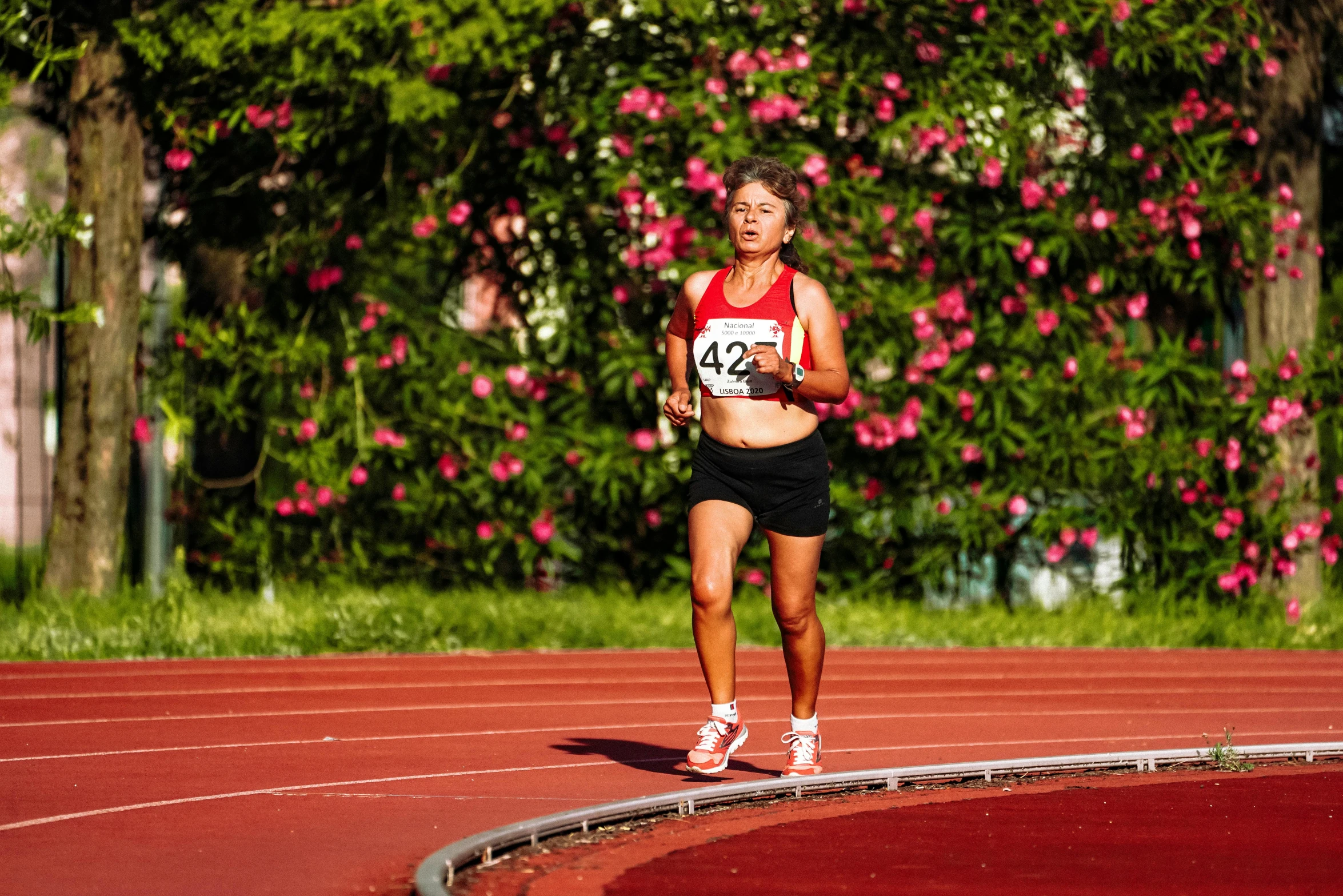 a women who is running on a track