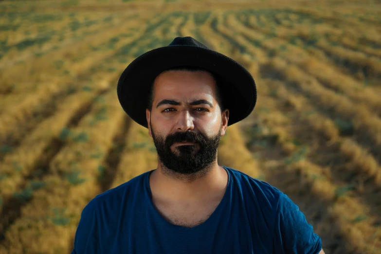 a man standing in front of a vast field