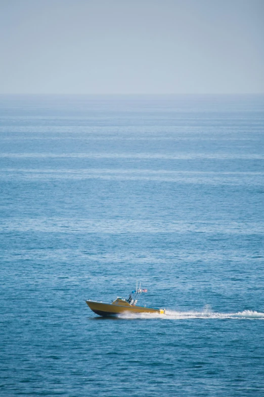 a boat is sailing across a large body of water