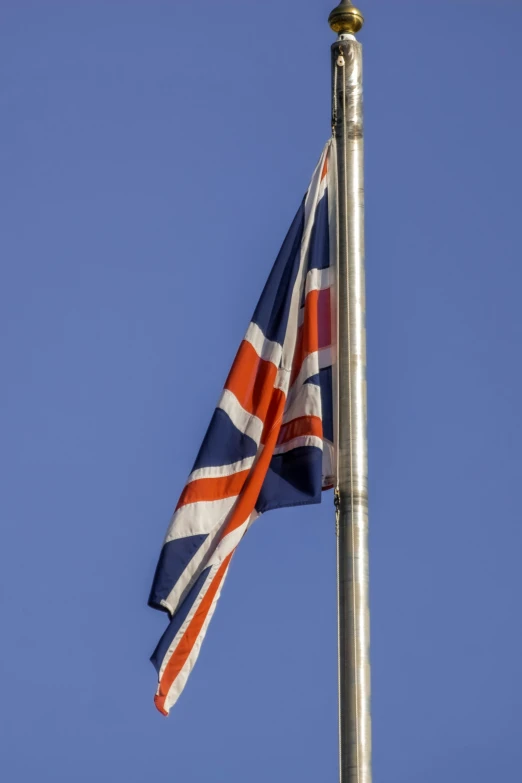 a british flag is flown high in the sky