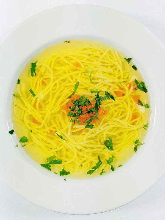 a bowl of spaghetti with lemon sauce
