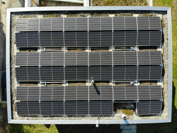a solar panel with several rows of black tiles