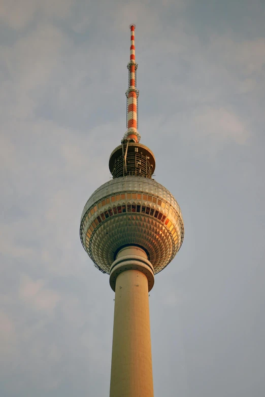 a view of the top of a tall tower in a clear sky