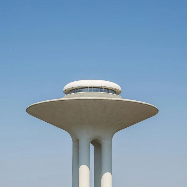 a very tall white building with many pillars