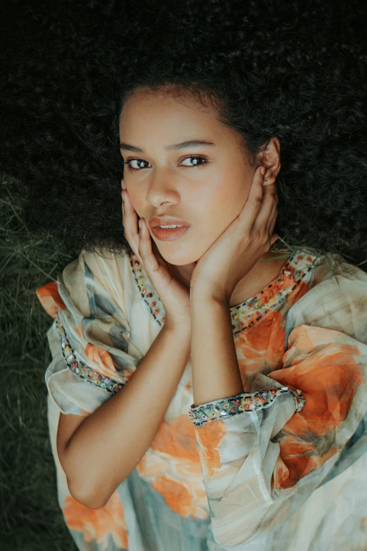 a painting of a girl in an orange and white dress