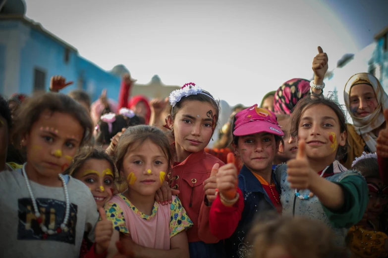 a group of children pose for the camera