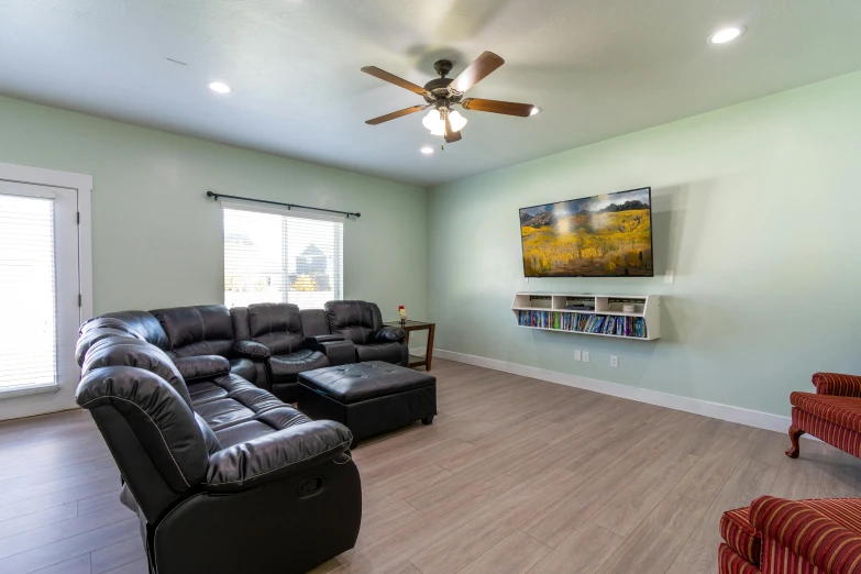 a living room with couches and chairs in it