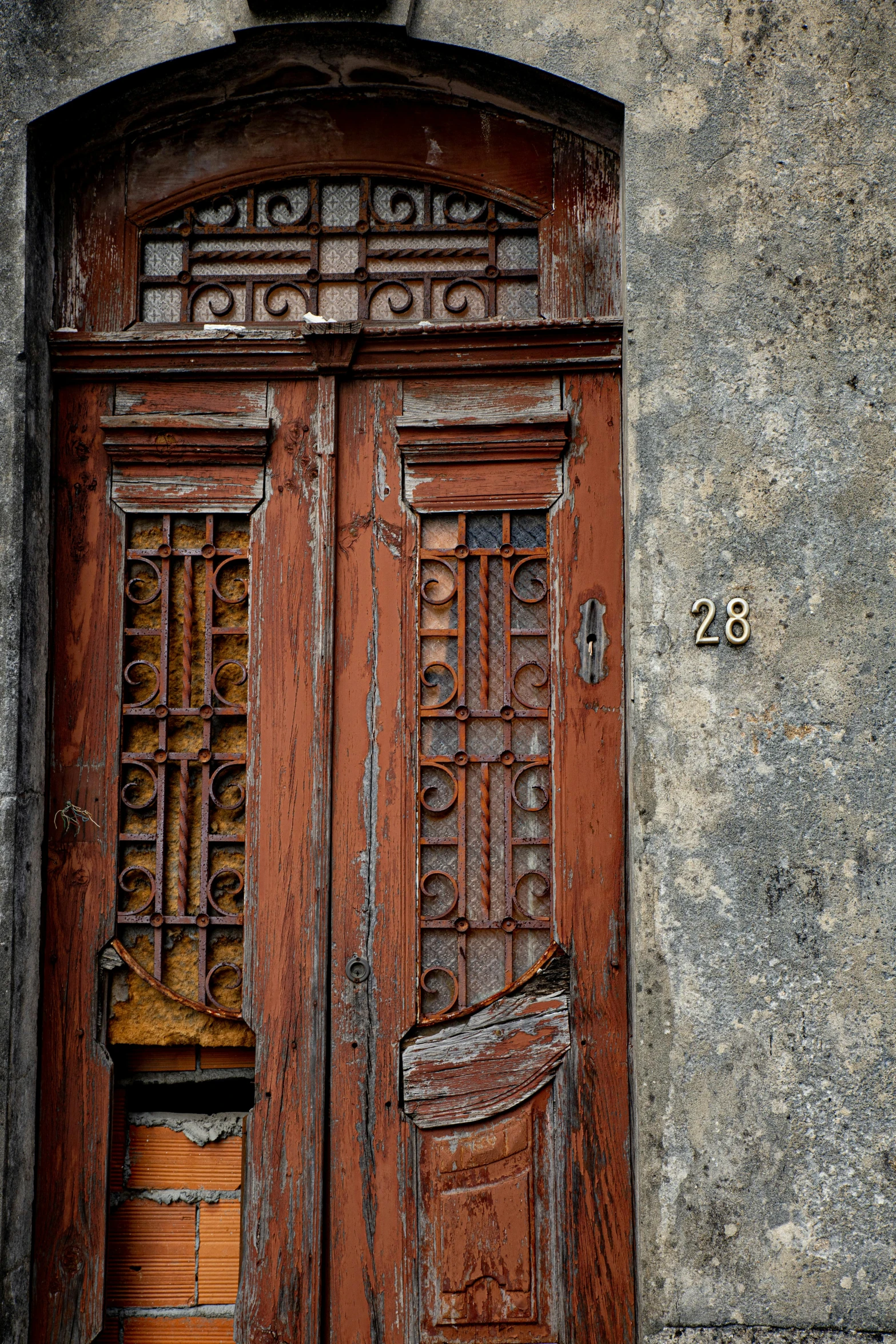 an old building with some very dirty doors