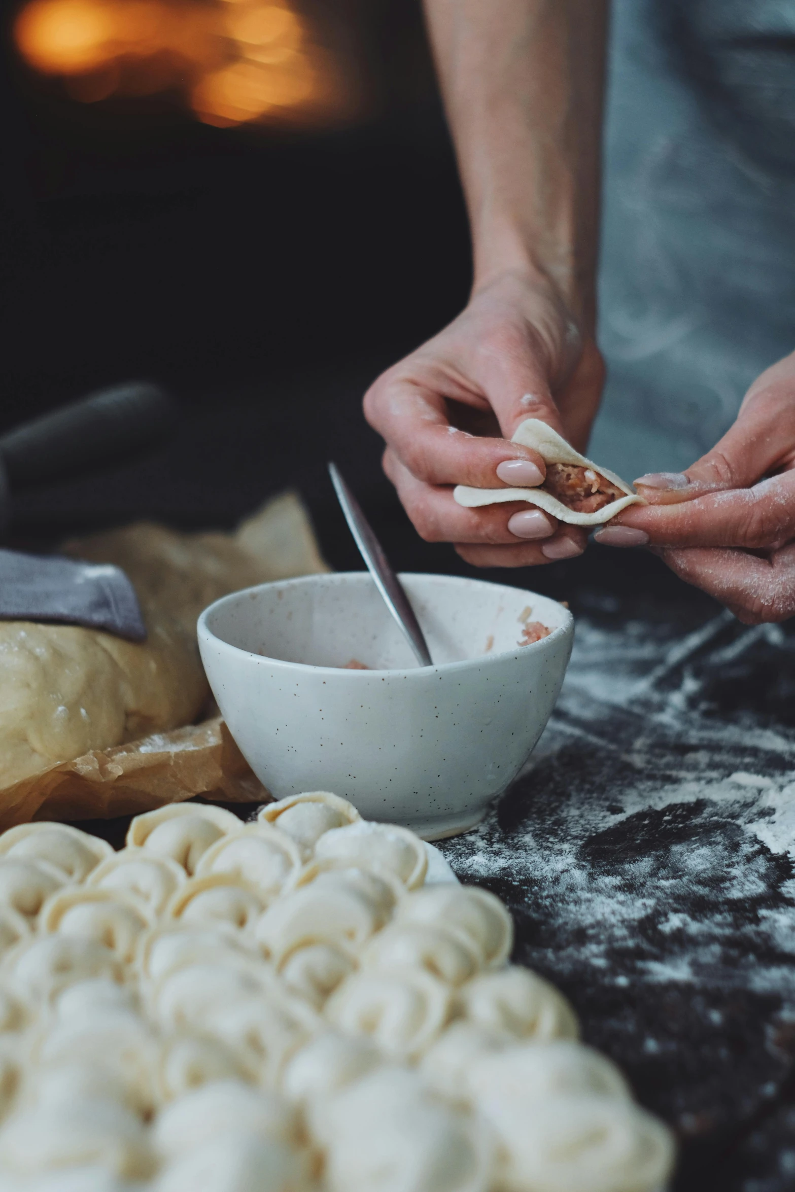 some food in bowls and doughnuts that are on a table