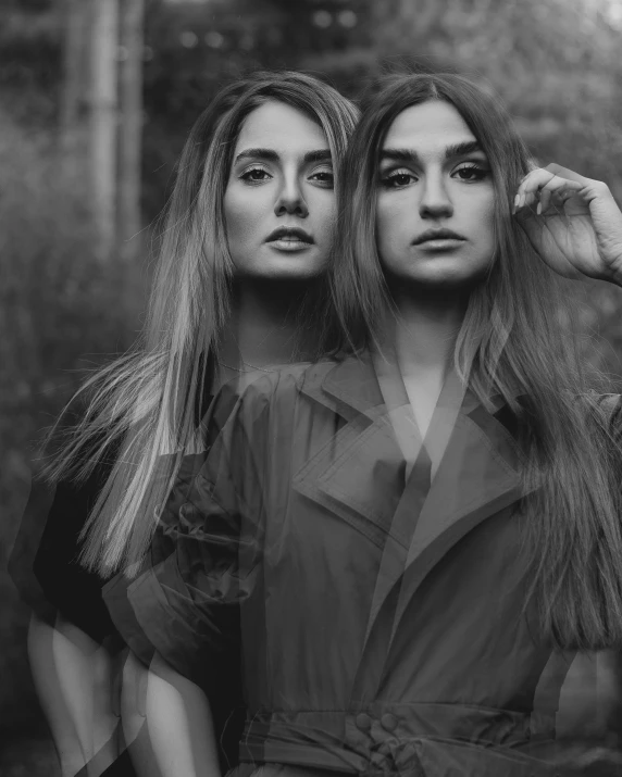 two women with long hair in black and white