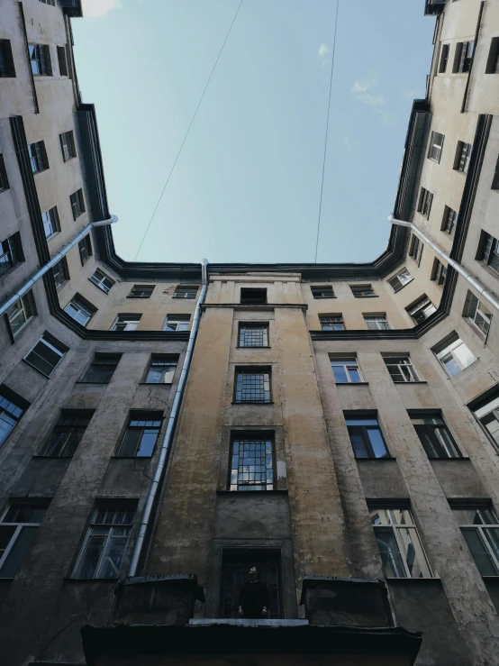 looking up from a high floor apartment building