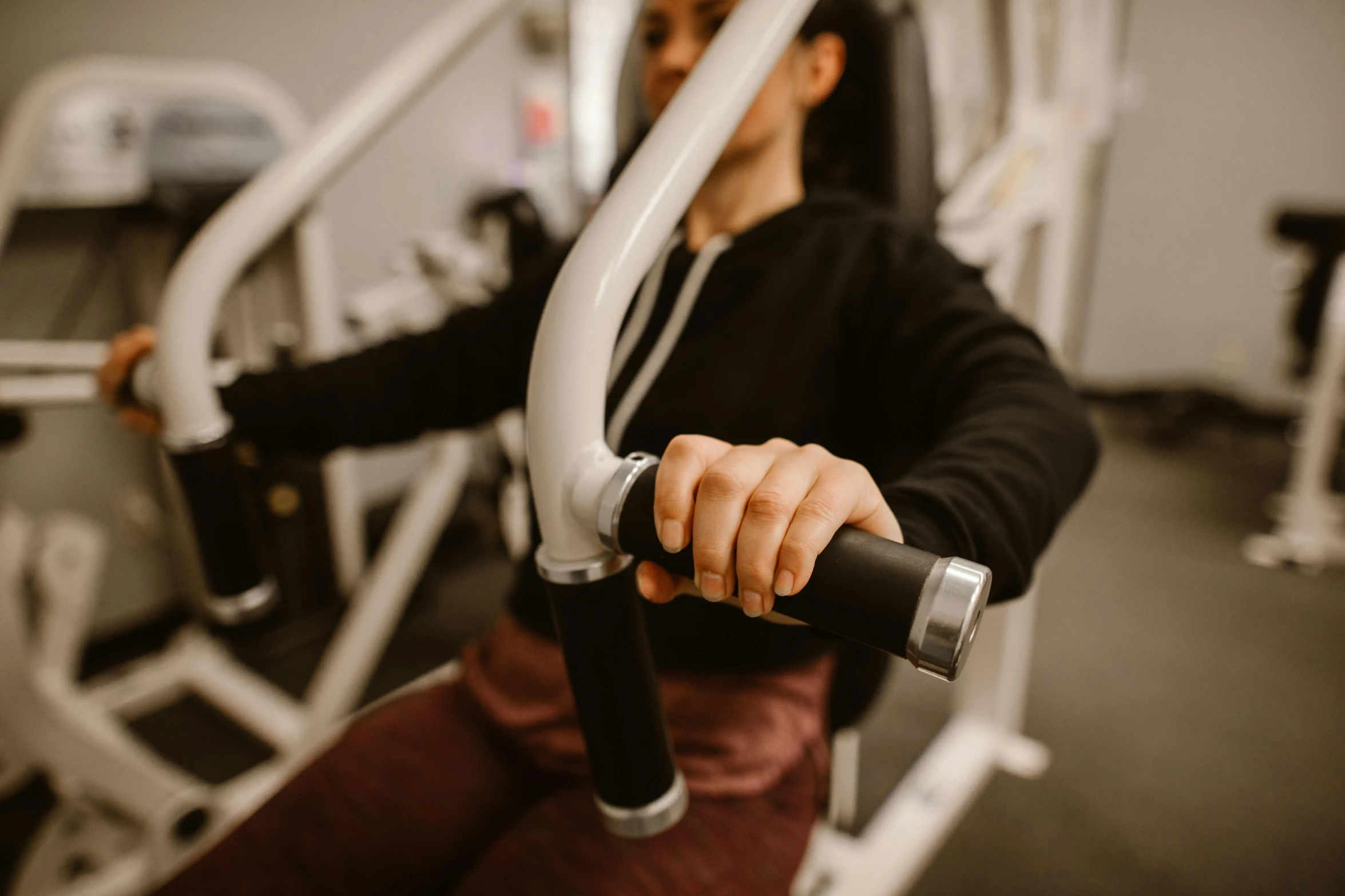 a man working out at a gym on a machine