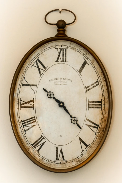 a large old looking clock mounted on the wall