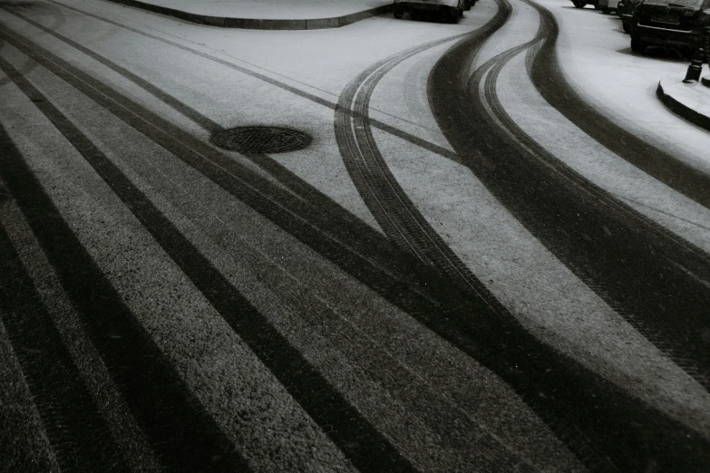 a couple of snow boards are in the middle of a snowy street