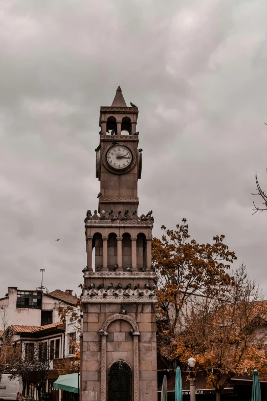 a tall clock tower towering over a city