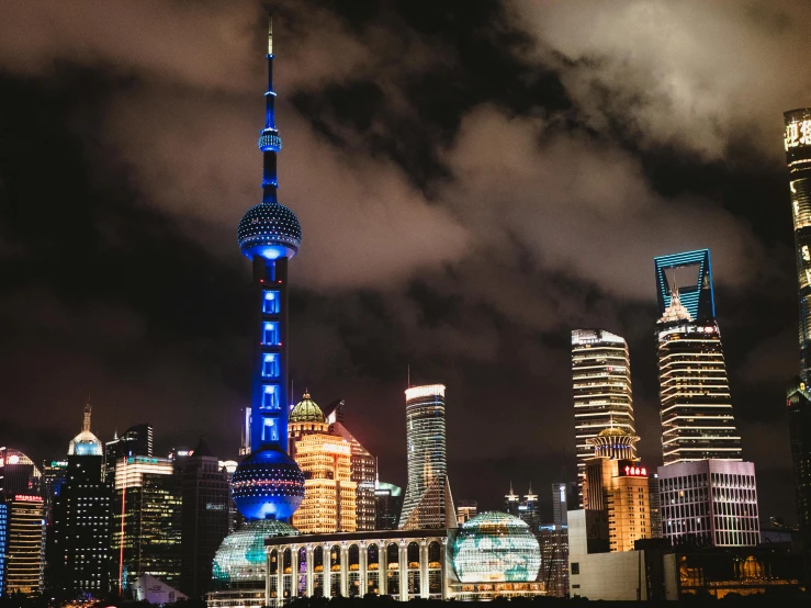 the tokyo sky tree is illuminated blue and white