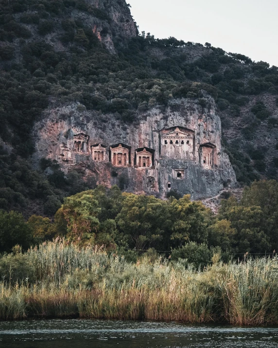 some cliffs and water with buildings on them