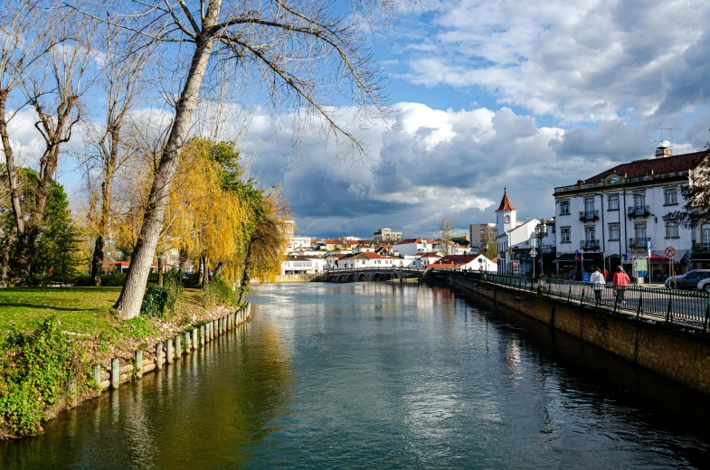 a river runs through a city and passes by buildings