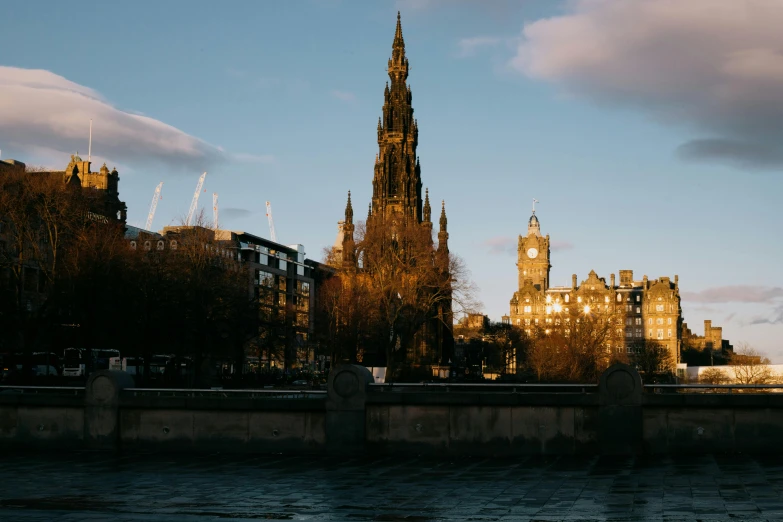 the city skyline with a church tower in the background