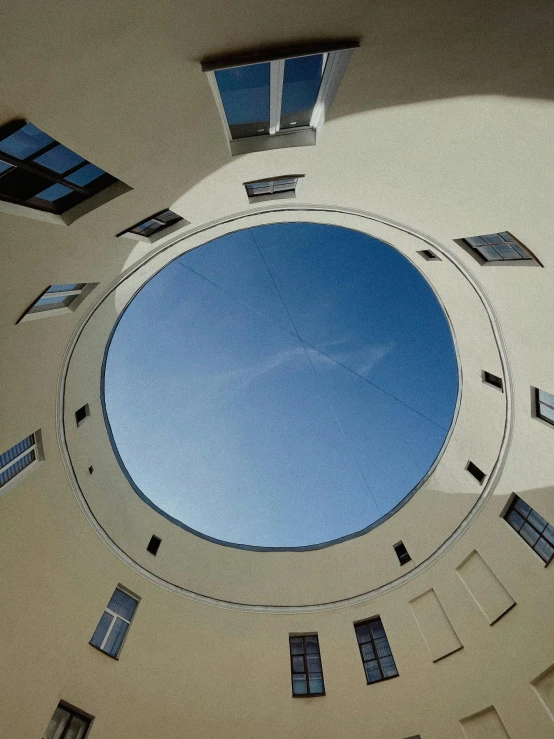 an overhead view of the inside of a building with open windows