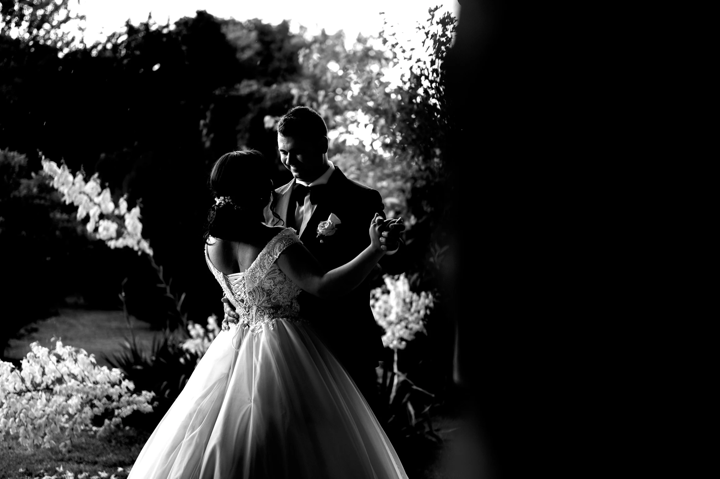 black and white po of a bride and groom at night