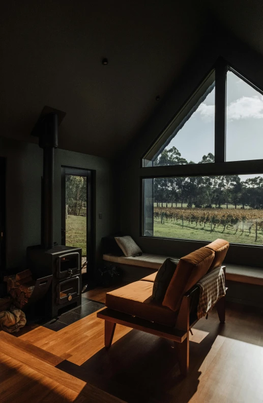 view from a cozy loft with a seating area and wood burning stove